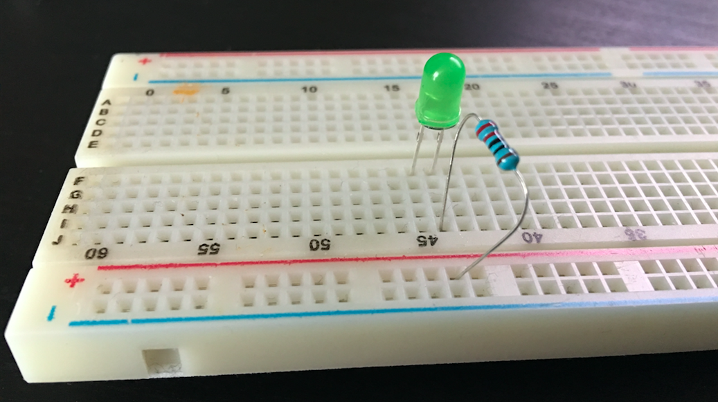 Breadboard with 220 ohm resistor and green LED